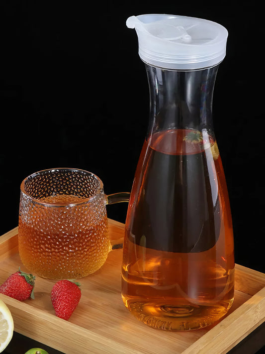 Plastic tea pot with a glass cup contain fruit tea